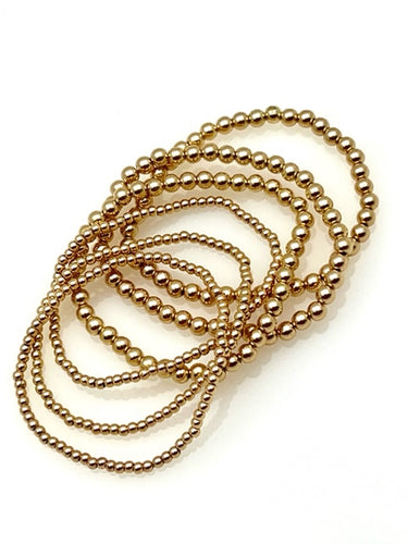 Multiple Gold Stretch Bracelets in two bead sizes - 6 bracelets